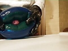Wanking and cumming in a latex water wing
