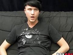 Young gay man jerks off his giant dick during an interview