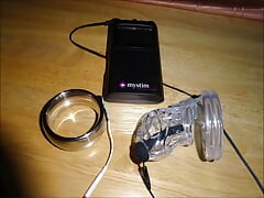 Estim cum milking with chastity device