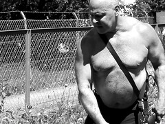 Big belly gay bear step daddy hunk muscle bear working in the garden. Film muscle gay hairy bodybuilder