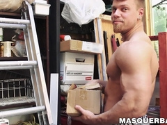 Handsome pierced hunk plays with his cock in his storage room
