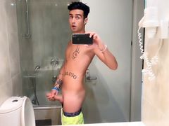 Quick hotel bathroom cumshot into sink in swim trunks while friend is gone