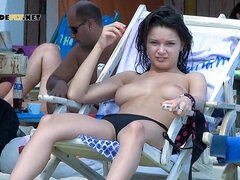 Energetic young nudist girls have fun outdoors