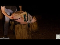 Ashley Lane receives a piss enema and dances through the forest after being anally probed