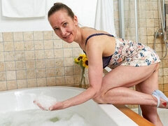 Lady Sweet Candy soaps her skinny body and plays in a foamy tub