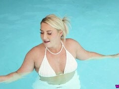 Busty Irich Essie flaunts her huge tits by the pool