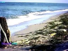 Big Tits dark haired Sensual Jane fingering at the beach