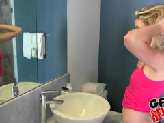 Blonde parker gives a sloppy bathroom handjob and gets a hot facial
