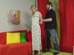 Submissive blonde is bound and face-fucked by a master