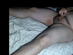 Lying on the bed and cumming
