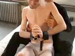 Cute twink enjoys having his feet tickled while laughing