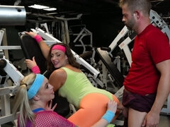 One lucky fitness instructor fucks two curvy babes in the gym