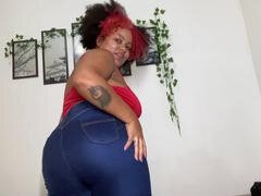 Curvy ebony beauty in blue denim shares her funny moments