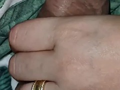 Stepmom handjob under the blanket makes her stepsons cock hard as a rock