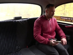 A stacked female taxi driver tempts a man with her big boobs
