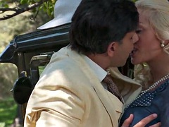Stunning blonde babe takes care of his hard cock outdoors