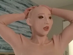 Dolling, sissification, female rubber mask