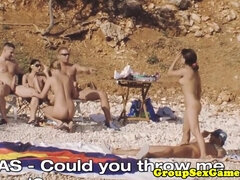 Naughty beach babes in a wild group fuck frenzy with a big titted girl riding cock in HD