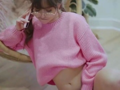 Brunette female in pink sweater likes a phone kink