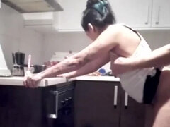 He fucks his wife in the kitchen while the are in the room