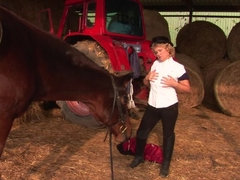 Kinky mama playing with herself in a barn