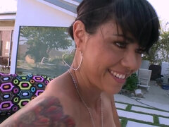 A milf with a big ass and some sexy tattoos does anal sex