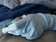 Naughty girl in satin gloves gives handjob with a twist