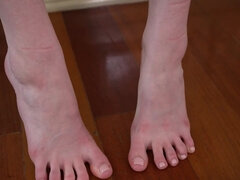 Cute teen showing off her soles on the kitchen island