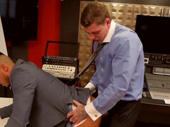 Tattoed pervert with a big cock penetrates a businessman