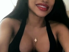 A super sexy brunette massages her big boobs
