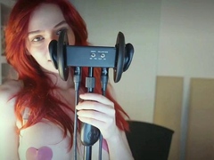 Redheaded pierced teen close up toy show