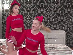 Watch these hot cheerleaders in mini skirts and lingerie licking each other's pussies!