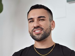 Anxious jock wanks his cock until he cums after giving an interview