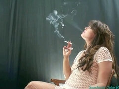 Smoking hot MILF indulges in self-pleasure, seductive posing, and smoking