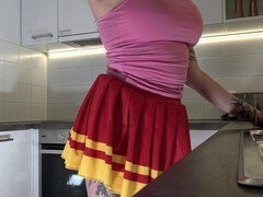 Smoking hot ginger-haired cheerleader shows off her see-through panties in the kitchen while wearing over-the-knee socks