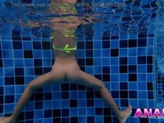 Asian Girl Swims with Big Butt Plug