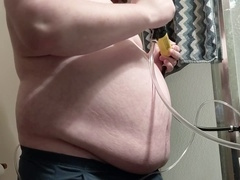 Extreme gay belly inflation as nearly two gallons of water fill up the stomach