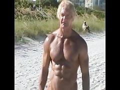 an older guy shows a big white cock to a nudist beach