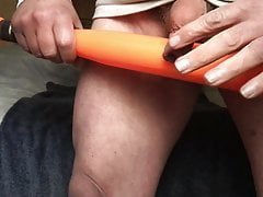Standing floppy foreskin with: baseball bat