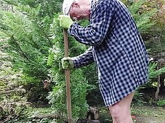 Gardener dad moving bushes