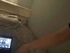 Man in the room masturbates on the bed to gay porn and cum in a bag