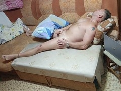 My hubby strips on the couch and strokes his cock.