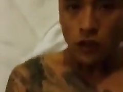 Tattooed Chinese guy gets fucked
