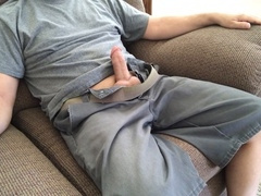 Older woman kicks back and enjoys a creamy cumshot