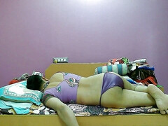 Cute sissy crossdresser femboy Sweet Lollipop in a crop top and string bikini bottom.