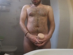 Young Euro guy masturbates with Fleshlight in bathroom