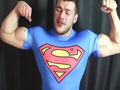 superman flexes his big muscles