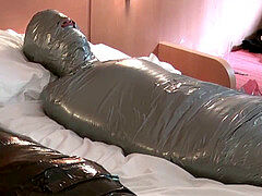 Mummified and Locked in A Rubber Sleepsack by Dave bind 'Em Up