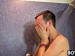 handsome lad gets naked in the douche and rides a wall fake penis