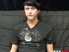 Young gay man jerks off his giant dick during an interview